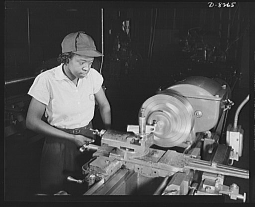 From National Youth Administration (NYA) to Washington navy yard. Beginning as a helper at $4.56 a day in the Washington navy yard, Miss Juanita E. Gray graduate trainee of the National Youth Adminstration War Production and Training Center now earns $45 a week. More than 300 NYA trained Negro women