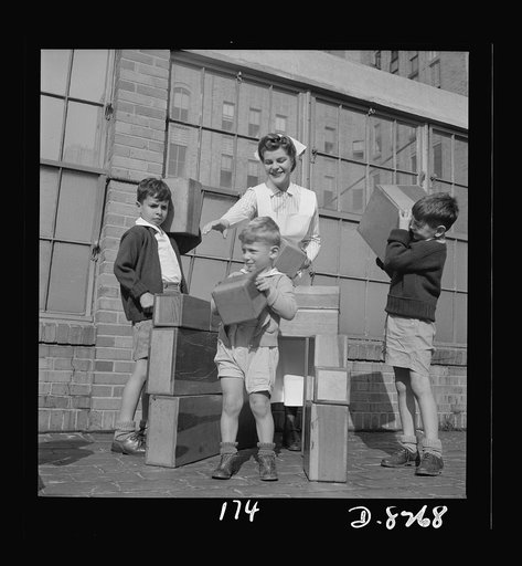 Nurse training. On the sun roof of Babies Hospital, New York City, student nurse Susan Petty distributes construction toys to young convalescents and "ambulatory" patients. As part of her education, Miss Petty takes her turn at playing with the children and enlisting their interest in the activities