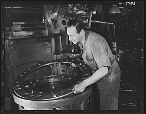 Winner of the plant award. David Danzig, an employee of the American Locomotive Company, Schenectady, New York, applies the fixture he suggested and designed for the facing and cutting champer on the small turret ring for the M-4 tank. The fixture is designed for three generations instead of two, sa