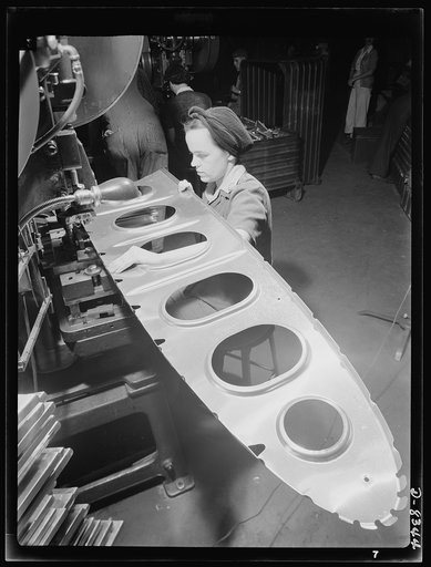 Production. B-17F heavy bomber. Sharon Arnott, punch press operator at the Boeing plant in Seattle, performs an operation on a large reinforcing part for a new B-17F (Flying Fortress) bomber. The Flying Fortress, a four-engine heavy bomber capable of flying at high altitudes, has performed with grea