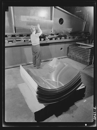 Production. B-17F heavy bomber. A section of the "skin" that fits around the was new B-17F (Flying Fortress) bombers are finished in a hydraulic press at the Boeing plant in Seattle. The Flying Fortress, a four-engine heavy bomber capable of flying at high altitudes, has performed with great credit 