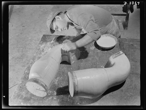 Production. B-17F heavy bomber. E. Waters finishes plaster casts of ducts for B-17F (Flying Fortress) bombers at the Boeing plant at Seattle. The patterns will be reproduced on a Kellar machine. The Flying Fortress, a four-engine heavy bomber capable of flying at high altitudes, has performed with g