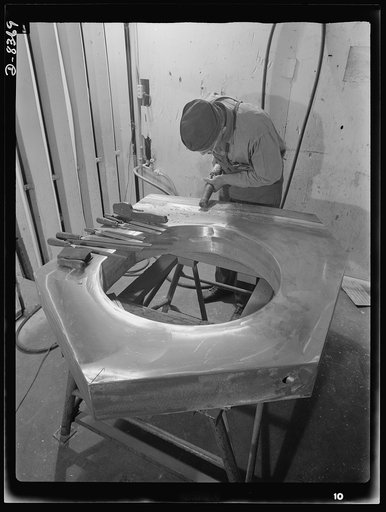 Production. B-17F heavy bomber. H.J. Ross finishing a die for a part for B-17F (Flying Fortress) bombers at the Boeing plant at Seattle.  The Flying Fortress, a four-engine heavy bomber capable of high altitudes, has performed with great credit in the South Pacific, over Germany and elsewhere