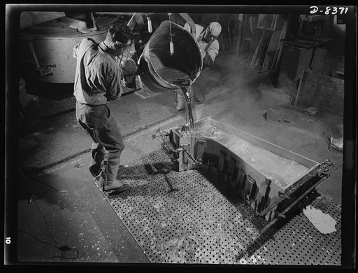 Production. B-17F heavy bomber. Pouring a lead die to be used in the production of parts for B-17F (Flying Fortress) bombers at the Boeing plant at Seattle.  The Flying Fortress, a four-engine heavy bomber capable of high altitudes, has performed with great credit in the South Pacific, over Germany 