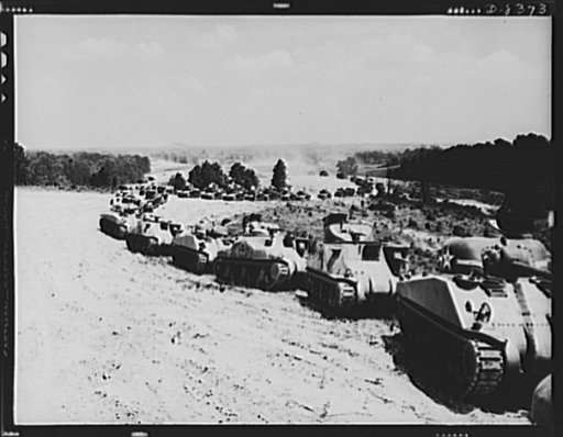 Fort Knox: Tank training. Parade of M-4 (General Sherman) and M-3 (General Grant) tanks in training maneuvers at Fort Knox, Kentucky. Note the lower design of the M-4, the larger gun in the turret and the two batches in front of the turret
