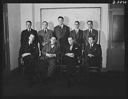 Leon Henderson and staff. Deputy administrators of the Office of Price Administration (OPA) with Leon Henderson, Administrator, in Washington, D.C. just prior to Mr. Henderson's retirement from office. Seated, left to right, J.K. Galbraith, Mr. Henderson, John E. Hamm, David Ginsburg. Standing, left