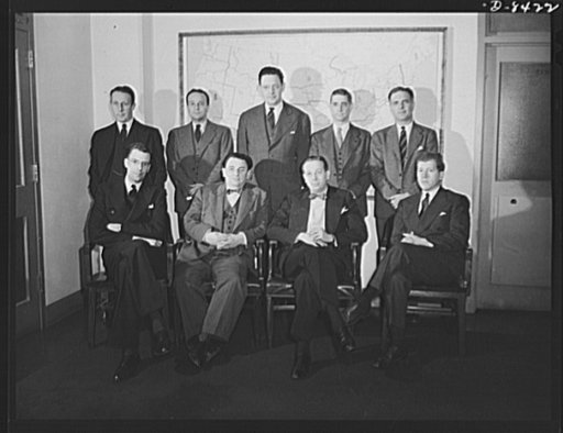 Leon Henderson and staff. Deputy administrators of the Office of Price Administration (OPA) with Leon Henderson, Administrator, in Washington, D.C. just prior to Mr. Henderson's retirement from office. Seated, left to right, J.K. Galbraith, Mr. Henderson, John E. Hamm, David Ginsburg. Standing, left