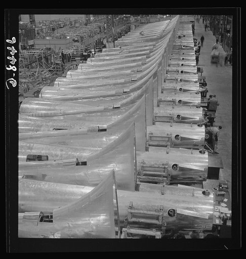 Production. B-17 heavy bomber. Tail sections of B-17F (Flying Fortress) bombers ready for assembly into the big warships of the air at the Boeing plant in Seattle. The Flying Fortress has performed with great credit in the South Pacific, over Germany and elsewhere. It is a four-engine, heavy bomber 