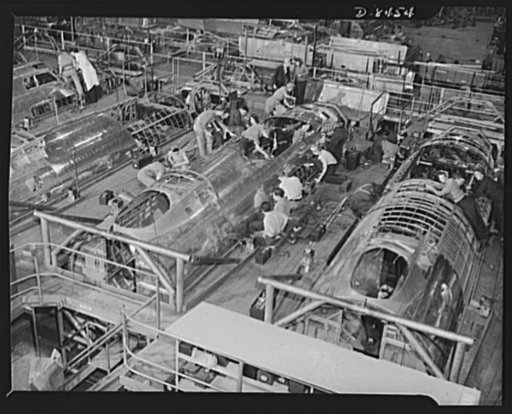Production. B-17 heavy bomber. Fast, expert workers at the Boeing plant in Seattle apply outer "skins" to fuselage sections for new B-17F (Flying Fortress) bombers, while assembly and fitting operations go forward in the interiors. The Flying Fortress has performed with great credit in the South Pac