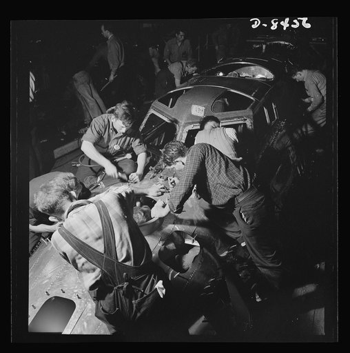 Production. B-17 heavy bomber. Fast, expert workers at the Boeing plant in Seattle apply outer "skins" to fuselage sections for new B-17F (Flying Fortress) bombers, while assembly and fitting operations go forward in the interiors. The Flying Fortress has performed with great credit in the South Pac