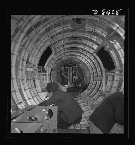 Production. B-17 heavy bomber. Women riveters at the Boeing plant in Seattle work at assembly and fitting operations in the fuselage of a new B-17F (Flying Fortress) bomber. The Flying Fortress has performed with great credit in the South Pacific, over Germany and elsewhere. It is a four-engine heav