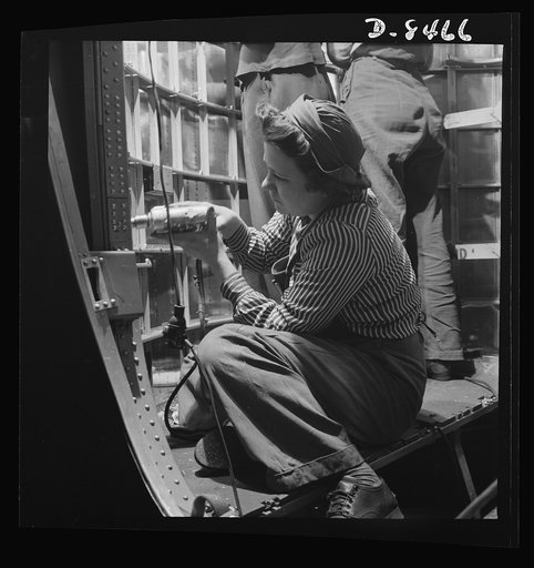 Production. B-17 heavy bomber. Women riveters at the Boeing plant in Seattle work at assembly and fitting operations in the fuselage of a new B-17F (Flying Fortress) bomber. The Flying Fortress has performed with great credit in the South Pacific, over Germany and elsewhere. It is a four-engine heav