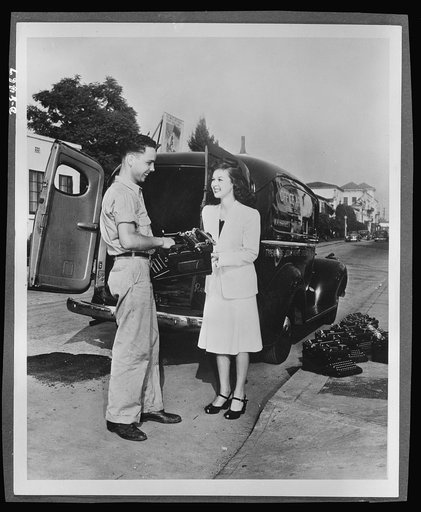 Paramount Picture star sends her typewriter to war. Susan Hayward, Paramount motion picture star, does her share in sending typewriters to war. Pictures shows Miss Hayward selling her machine to the government as her contribution to the typewriter campaign. Uncle Sam needs 600,000 typewriters for th