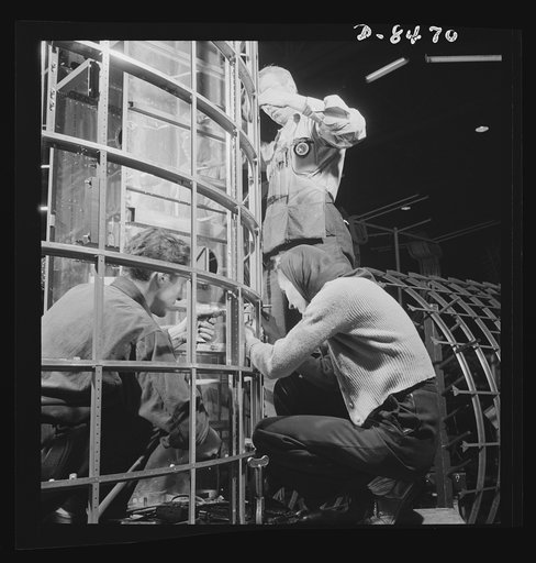 Production. B-17 heavy bomber. Men and women work together to complete a fuselage framework for a new B-17F (Flying Fortress) bomber. About half of the workers in this plant are women. The Flying Fortress has performed with great credit in the South Pacific over Germany and elsewhere. It is a four-e