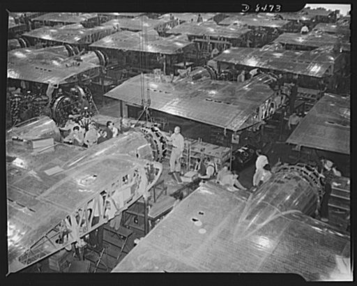Production. B-17 heavy bomber. Wing section, each containing two powerful Wright engines await mating the fuselage sections of new B-17F (Flying Fortress) bomber. The Flying Fortress has performed with great credit in the South Pacific, over Germany and elsewhere. It is a four-engine heavy bomber ca
