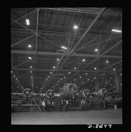 Production. B-17 heavy bomber. A nearly complete B-17F (Flying Fortress) bomber at the Boeing's production line in the Seattle plant. The Flying Fortress has performed with great credit in the South Pacific, over Germany and elsewhere. It is a four-engine heavy bomber capable of flying at high altit