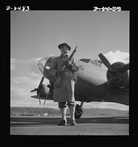 Production. B-17 heavy bomber. An Army sentry guards new B-17F (Flying Fortress) bombers at the airfield of Boeing's Seattle plant. The ship will be delivered to the Army and the Navy after they have successfully undergone flight tests. The Flying Fortress has performed with great credit in the Sout