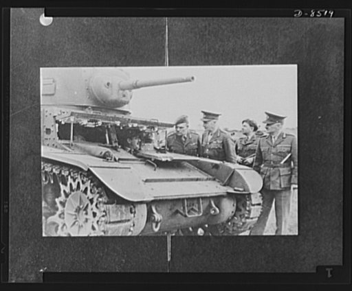 Cruiser training tanks arrive from America. Captain Fletcher (in tank) discusses points of interest of the first cruiser training tank to arrive in Victoria, Australia, from America. With Major General Northcott, Commanding Officer of Australia's First Armoured Division and Major General E.J. Milfor