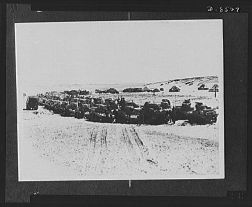 New American tanks leaving for the desert. Large numbers of American light and medium tanks that are arriving in the Middle East line up waiting to be sprayed with paint. They are taken to camps for fitting out and then sent on their first stage to the desert by train