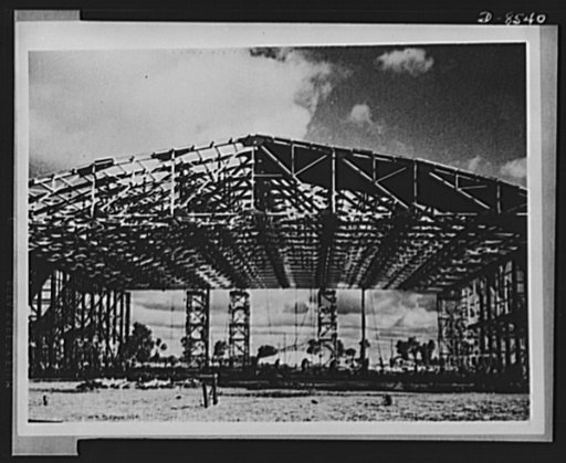One year of reciprocal aid. Australia has built many facilities for the American forces, including airfields, barracks and motor vehicles. Here is shown the largest airfield in Australia, covering some forty square miles, with repair hangers, workshops and living quarters. This is one of 100 such fi