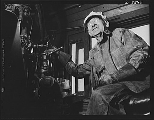 Tennessee Valley Authority. Railroad crews at Watts Bar Dam. A combination of long mechanical experience, practical railroad training and common sense is required for the job of running one of the big "hogs," or locomotives. This engineer handles a train which hauls materials for the building of TVA