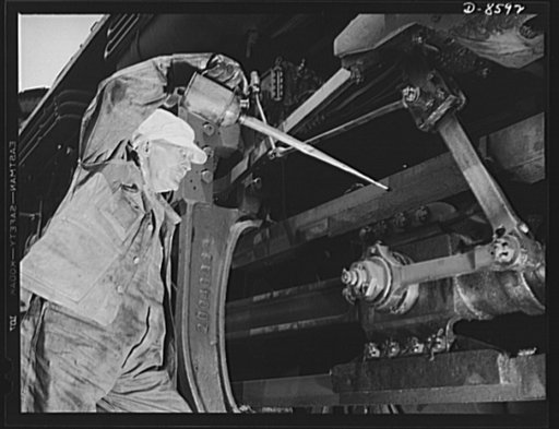 Tennessee Valley Authority. Railroad crews at Watts Bar Dam. The engineer, or "hog head" of a freight locomotive hauling materials for the building of TVA's Watts Bar Dam, oils the guides of the main driving rods of his engine. Long mechanical experience, practical railroad training and common sense