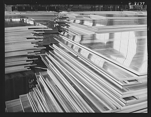 Production. Aluminum. Stacks of aluminum plates ready for the continuous rolling operation. By this process, thickness as fine as paper-thin sheets can be formed