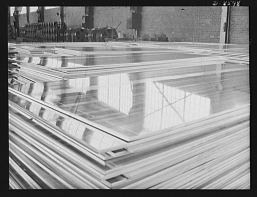 Production. Aluminum. Stacks of aluminum plates ready for the continuous rolling operation. By this process, thickness as fine as paper-thin sheets can be formed