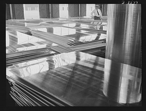Production. Aluminum. Stacks of aluminum plates ready for the continuous rolling operation. By this process, thickness as fine as paper-thin sheets can be formed