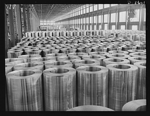 Production. Aluminum. Hundreds of coils of aluminum sheet stock assembled on the cooling floor prior to cold-rolling, the final thinning operation