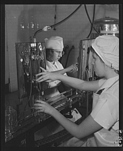 Production. Blood transfusion bottles. Preparing transfusion bottles for blood letting, Elizabeth Homan (left), and Nancy Synnestvedt, employees at Baxter Laboratories, Glenview, Illinois, are shown placing anti-coagulant solution in blood donor bottles