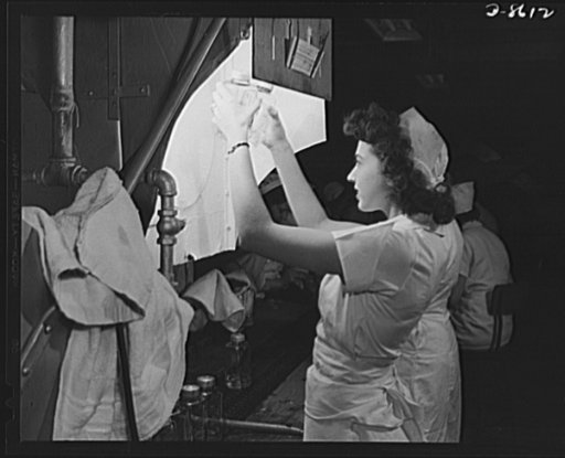 Production. Blood transfusion bottles. Transfusion bottles containing intravenous solution, are given final inspection by Grace Kruger, one of many women employees at Baxter Laboratories Inc., Glenview, Illinois. When her brother left Baxter's to join the Merchant Marine, Miss Kruger, a former life 