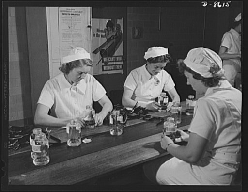 Production. Blood transfusion bottles. Housewives in war work "for the duration." Employed by Baxter Laboratories, Glenview, Illinois, these women workers are shown banding bottles used by the armed forces for blood transfusions, plasma, and serum. Evelyn Kohl (left) and Olive Western (right) each h