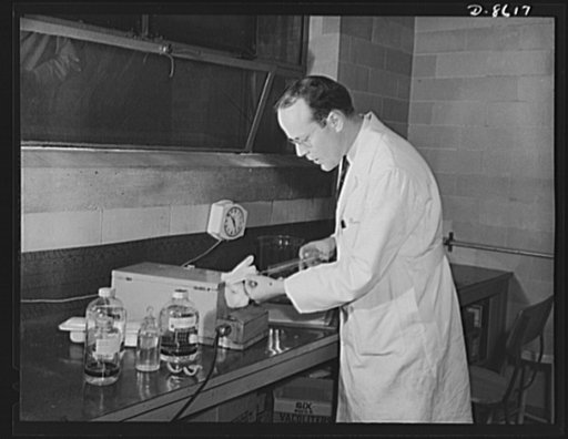 Production. Blood transfusion bottles. Rabbits too, aid the war effort. William Edwin Morris, histologist for Baxter Laboratories Inc., Glenview, Illinois, conducts research on blood plasma through experimentation on rabbits. The company prepares transfusion bottles for blood letting