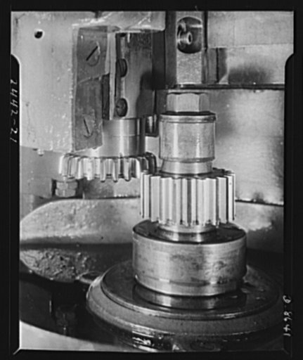 Conversion. Farm implements to cargo winches. A gear shaper in a large Midwestern farm implement plant works on the production of gears for essential farm equipment and for marine cargo winches. Gun slides and other military equipment are also produced in this plant since its conversion from straigh
