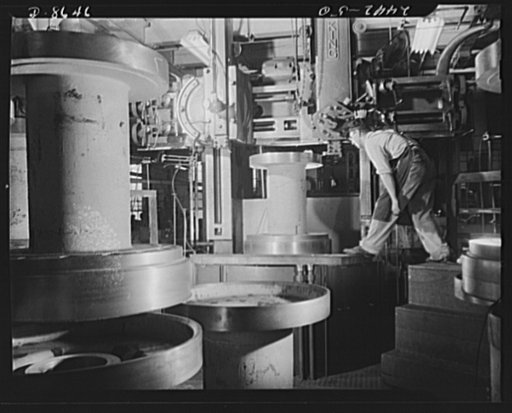 Conversion. Farm implements to cargo winches. Turning an outside cut on the flange of a cargo winch drum for the Maritime Commission. This machine in the converted plant of a Midwestern farm implement manufacturer was used to turn inside cuts on farm tractor wheels