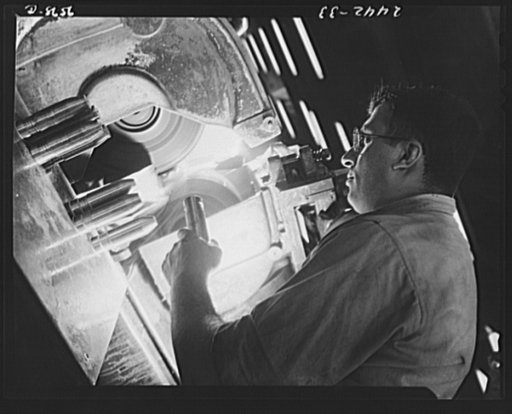 Conversion. Farm implements to 37 mm. shells. After conversion to war production, a Midwest farm equipment plant made use of a centerless grinder for turning out 37 mm. shells. The machine formerly was employed in grinding bell crank bearing pins for harvest machines