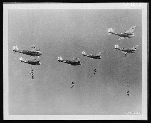Salvo of 600-pound bombs falling from formation of B-10 bombers in recent bombing practice by the 19th Bombardment Group, General Headquarters, Air Force, U.S. Army Air Corps
