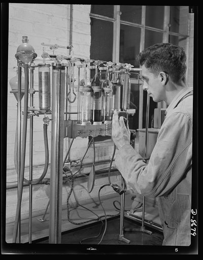 Science and research. Studies of non-coking coals. William S. Landers, assistant chemical engineer at the Golden, Colorado field station of the U.S. Bureau of Mines, uses precision gas analysis apparatus which measures the properties of gas made in a coke oven. This is important, since gas is a usab