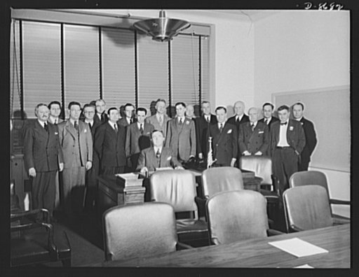 Charles E. Wilson, executive vice-chairman of the War Production Board (WPB), and staff. Standing, left to right: Arthur L. Hawley, assistant to Mr. Wilson; Carroll K. Shaw, executive officer; Ray C. Ellis, director of the Radio Division; T.P. Wright, director, Resources Controll Office, Aircraft Pr