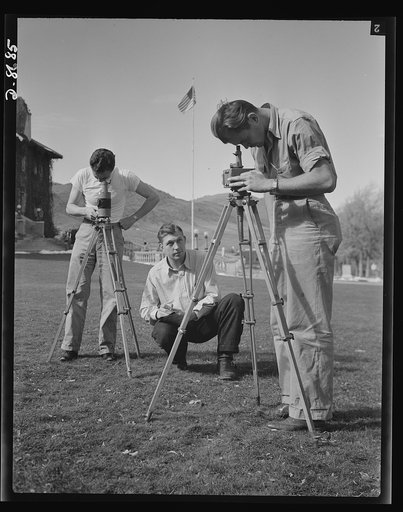 Science and research. Mineral prospecting. Intensity of the earth's magnetic field, something a mining engineer needs to know if he is looking for vital metals under the crust of the earth, may be measured by the horizontal magnetometer and the vertical magnetometer shown here. Three engineering stu