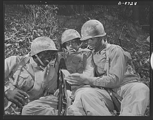 Fort Belvoir, Virginia. Negro infantry. These Negro infantrymen, enjoying a well-earned rest period during training exercises at Fort Belvoir, Virginia, represent a good type of soldier. When the Engineer Corps regiment to which they belong is graduated from Fort Belvoir they will be well prepared f