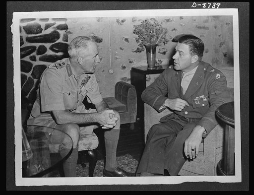American military delegation calling on Haile Selassie. Before its audience with His Majesty, Haile Selassie, Emperor of Ethiopia, the American military delegation, paid a courtesy call on the British commanding officer of the Ethiopian area, Major General Samuel Butler, left. He is shown with Colon
