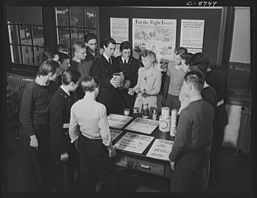 Preparation for point rationing. Lucy Knox, teacher at Mckinley High School, Washington, D.C., instructs members of a nutrition class on the effects of point rationing on balanced diet