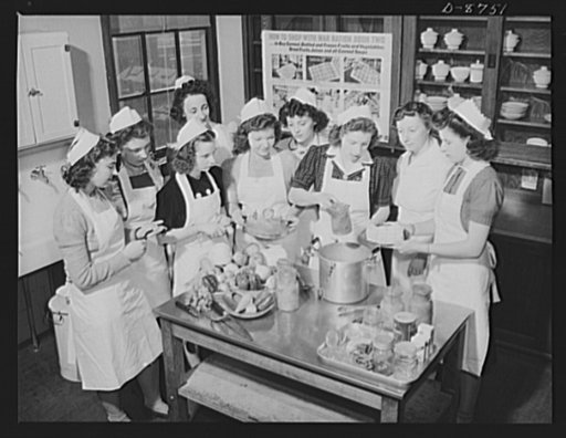 Preparation for point rationing. A home economics class of the McKinley High School, Washington, D.C., gets a practical lesson in home canning of fruits and vegetables, looking toward supplementing the limited allowance of canned foods available to holders of war ration book two. Mrs. Elouise Gummer