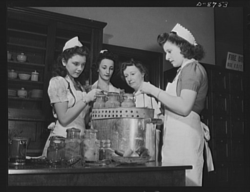 Preparation for point rationing. With canned fruit now on the rationed list, these home economics pupils of the McKinley High School, Washington, D.C., are being taught skills which will be essential when next summer's canning season comes around