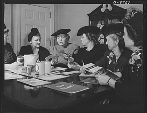 Preparation for point rationing. Mrs. Ola Day Rush (second from left), head of the Department of Home Economics of Washington, D.C. schools, studies the new point rationing system with a group of D.C. homemakers