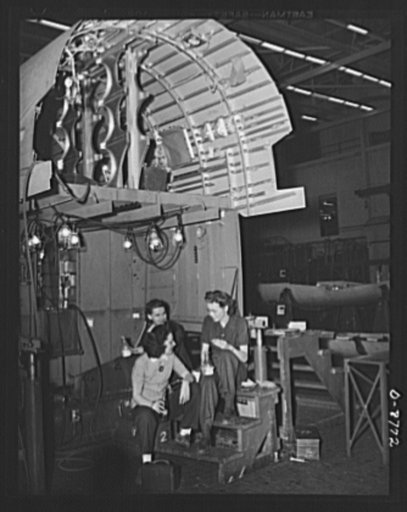 Production. B-24E (Liberator) bombers at Willow Run. The half-hour lunch period at Ford's big Willow Run plant is usually spent near one of the sections of the B-24E (Liberator) bombers. The Liberator is capable of operation at high altitudes and over great ranges on precision bombing missions. It h