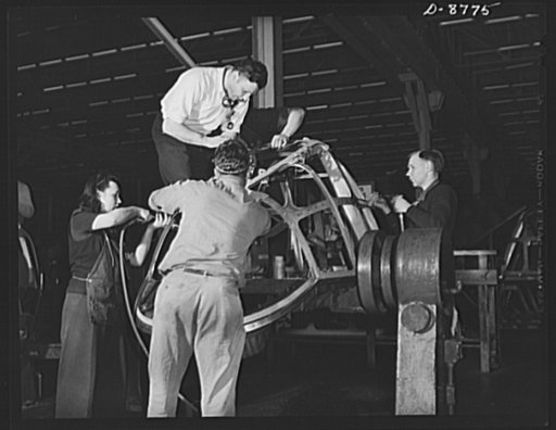 Production. B-24E (Liberator) bombers at Willow Run. Assembling the frame of a nose for a B-24E (Liberator) bomber in Ford's big Willow Run plant. The Liberator is capable of operation at high altitudes and over great ranges on precision bombing missions. It has proved itself an excellent performer 