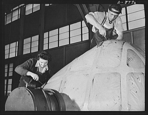 Production. B-24E (Liberator) bombers at Willow Run. Setting lights of transparent plastic in the nose for a B-24E (Liberator) bomber in Ford's big Willow Run plant. The Liberator is capable of operation at high altitudes and over great ranges on precision bombing missions. It has proved itself an e